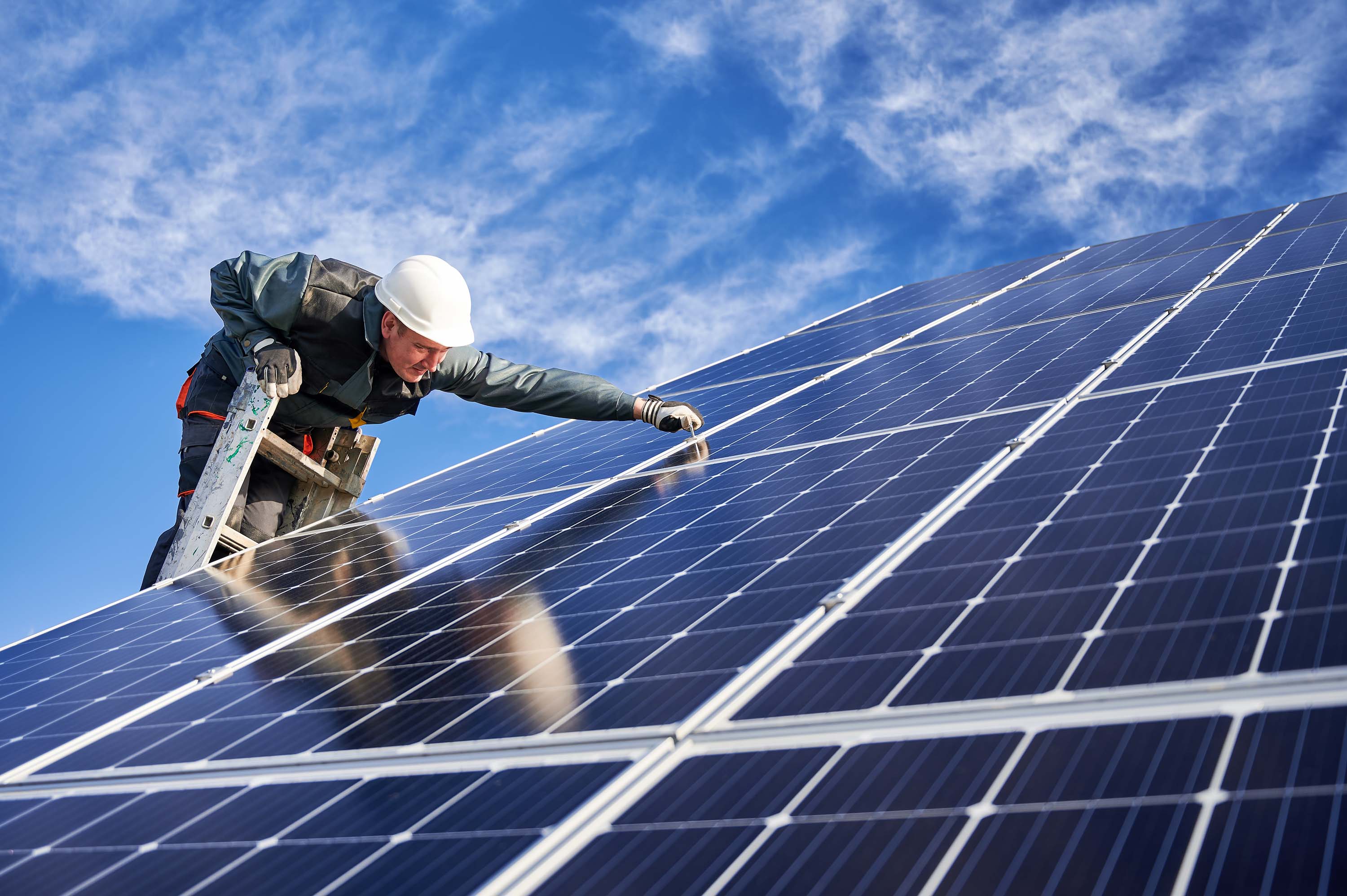 Man installing PV Solar Panel