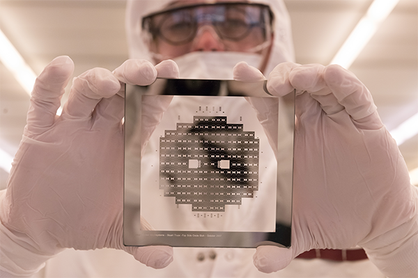 Cleanroom worker holding a wafer