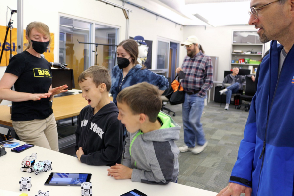 RAIL Lab Grad Students demonstrate robots to visitors at the 2023 Atlanta Science Festival