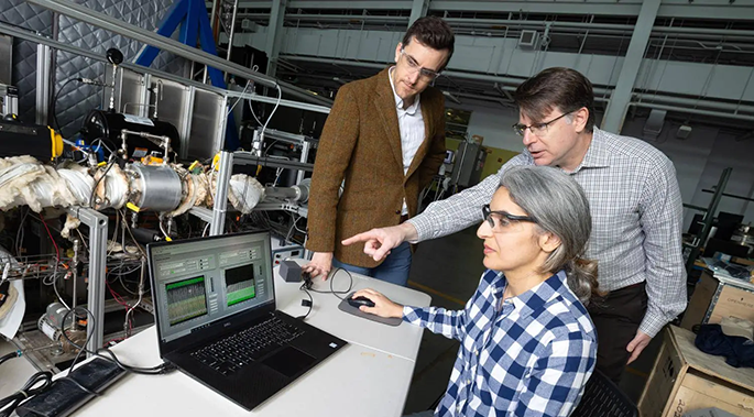 Postdoctoral fellow Poorandokht Kashkouli discusses test data from their direct air capture rig with Ryan Lively and Chris Jones. 