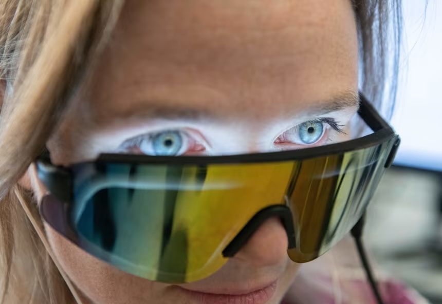 Anabelle Singer wears a glasses-like device that aids in her research