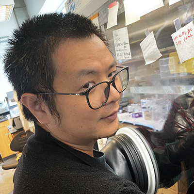 student working in the lab on an EV battery.