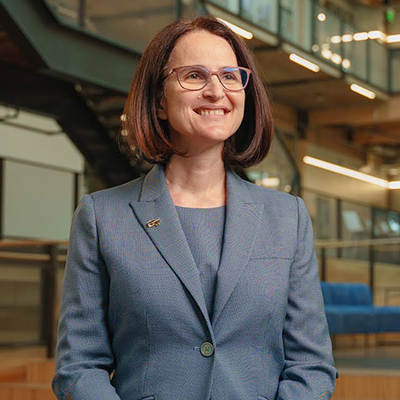 Beril Toktay standing in the lobby of Scheller College of Business at Georgia Tech.