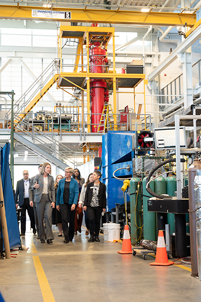 Georgia Tech's associate vice president for Research Operations and Infrastructure, Krista Walton, leads a tour of one of Georgia Tech's high-bay labs used for direct air capture research.