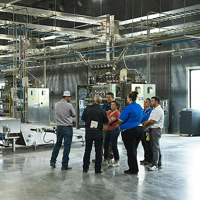 group of people in an industrial warehouse