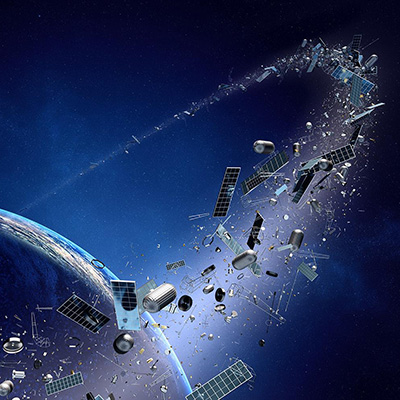 A white electric vertical takeoff and landing (eVTOL) aircraft with six propellers parked on a concrete airstrip, viewed from above.