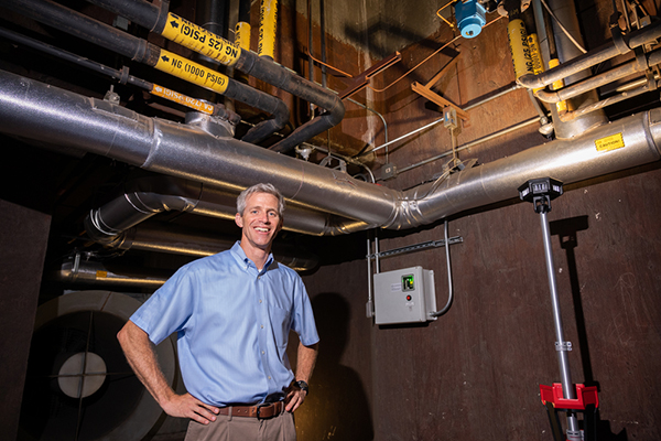 Tim Lieuwen standing in Georgia Tech's Ben T. Zinn Combustion Laboratory.