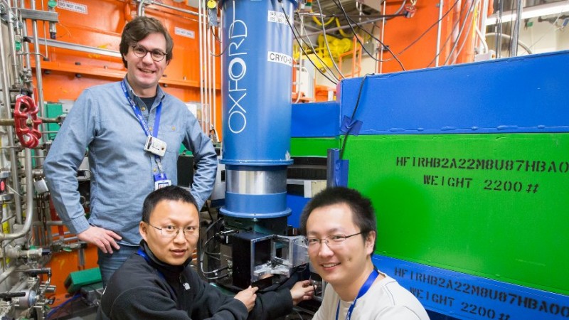 Georgia Tech’s Martin Mourigal (left) and Xiaojian Bai (right), along with Florida State University’s Lianyang Dong (center), explore low-temperature quantum states in the mineral Cu-Elpasolite at HFIR beam line HB-2A. (Image credit: ORNL/Genevieve Martin)