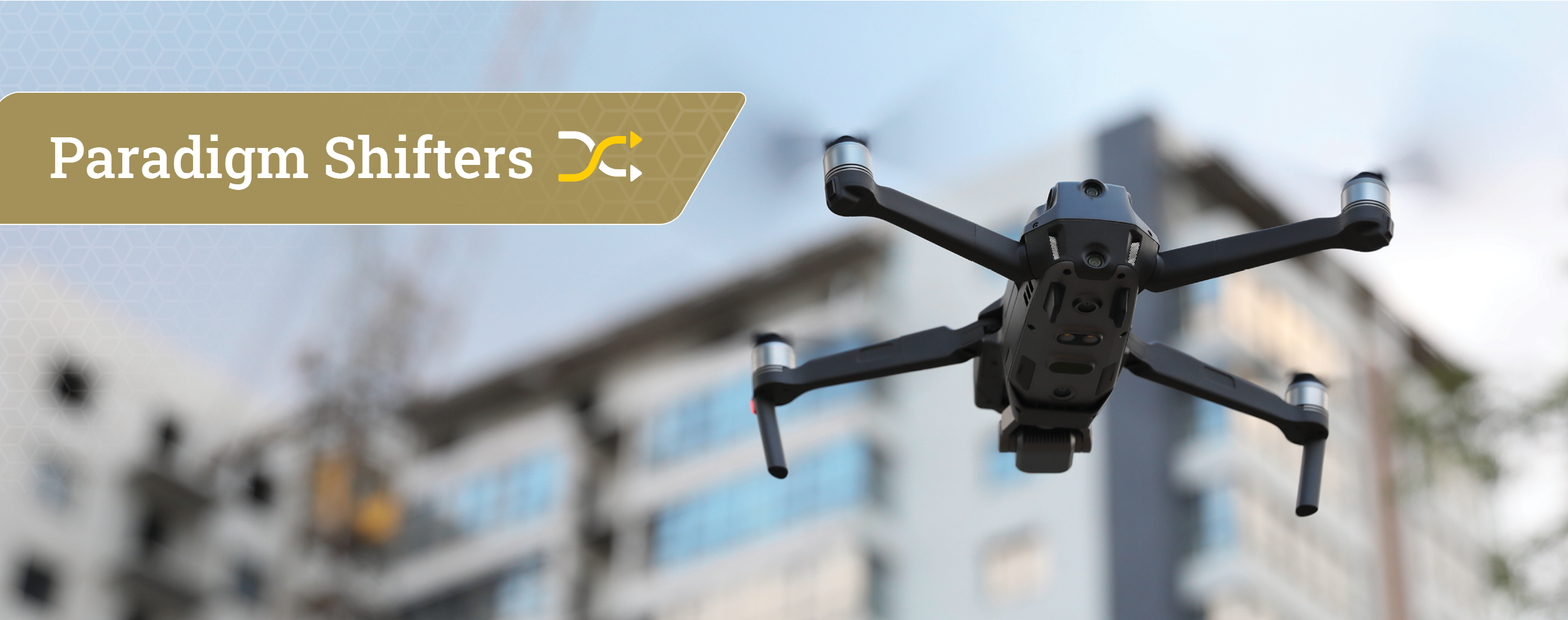 a dron flying in front of building in the background