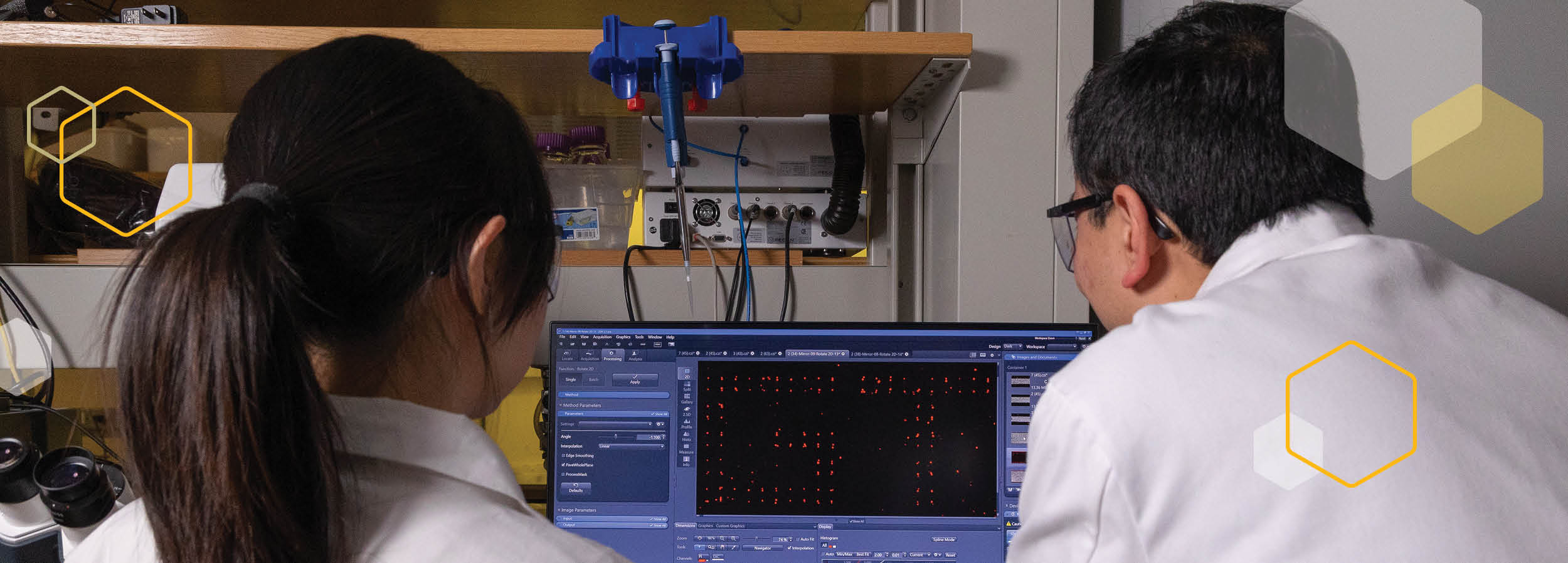 Xing Xie, the Carlton S. Wilder Assistant Professor in the School of Civil and Environmental Engineering, working in the lab with an assistant. 