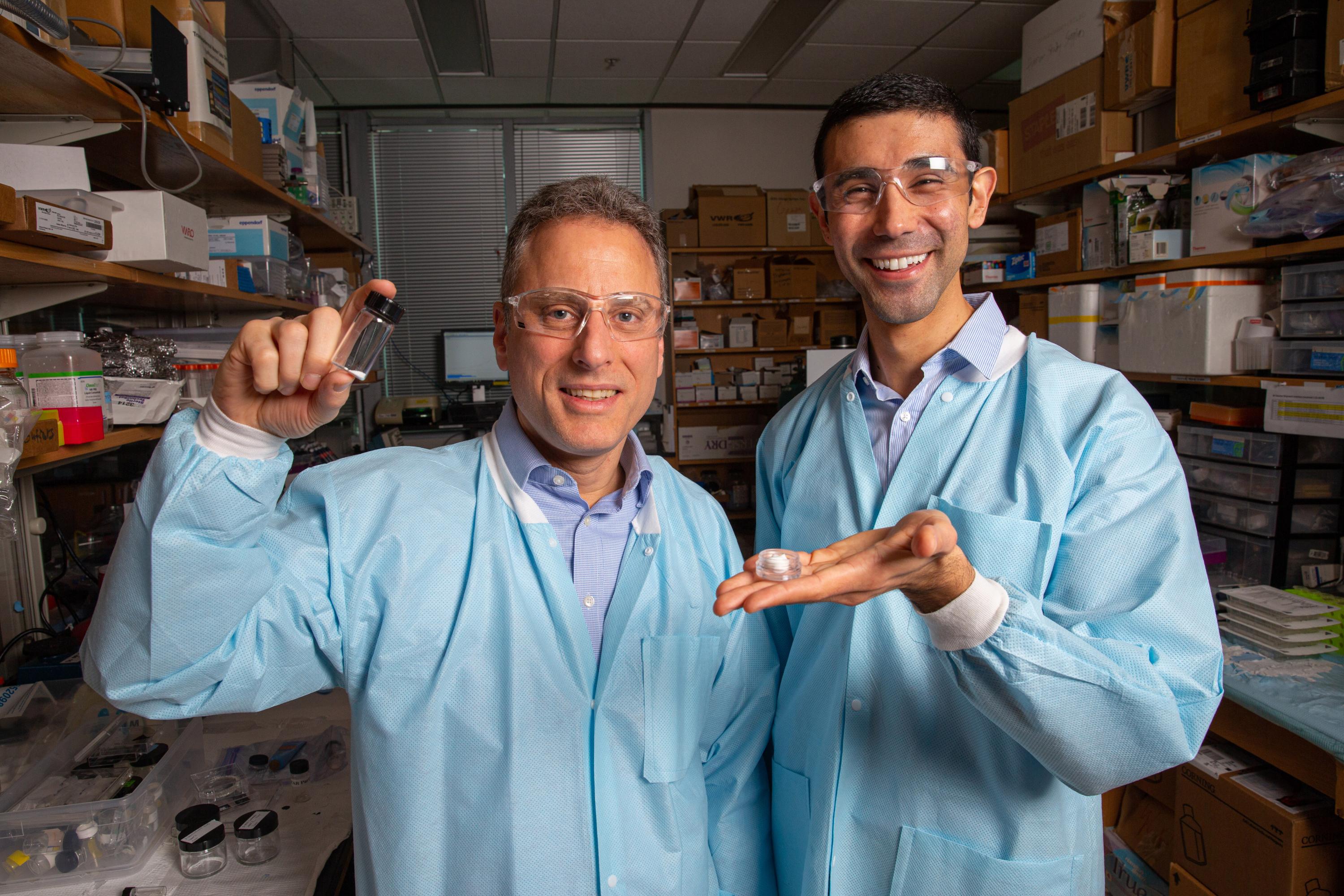 Georgia Tech Professor Mark Prausnitz and former Postdoctoral Scholar Andrew Tadros hold samples of the STAR particles, which could potentially facilitate better treatment of skin diseases including psoriasis, warts, and certain types of skin cancer. (Credit: Candler Hobbs, Georgia Tech)