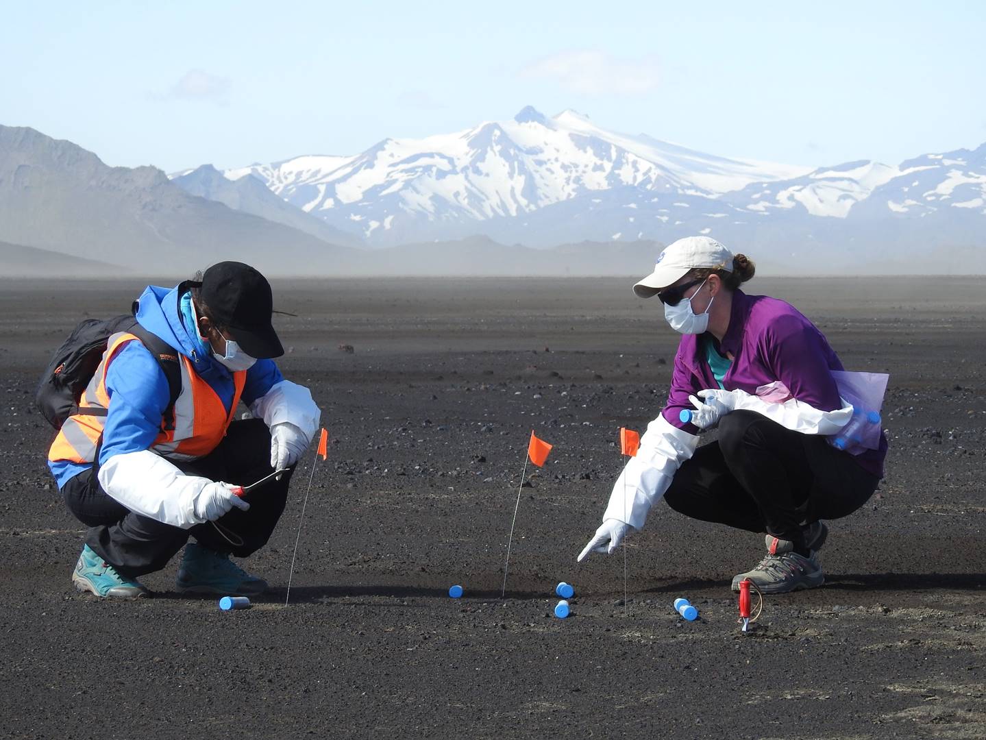 Gayathri Murekesan (left) and Stockton (right) sampling from a recently deglaciated basaltic tephra desert called Maelifellssandur in Iceland just north of Myrdasjokull.