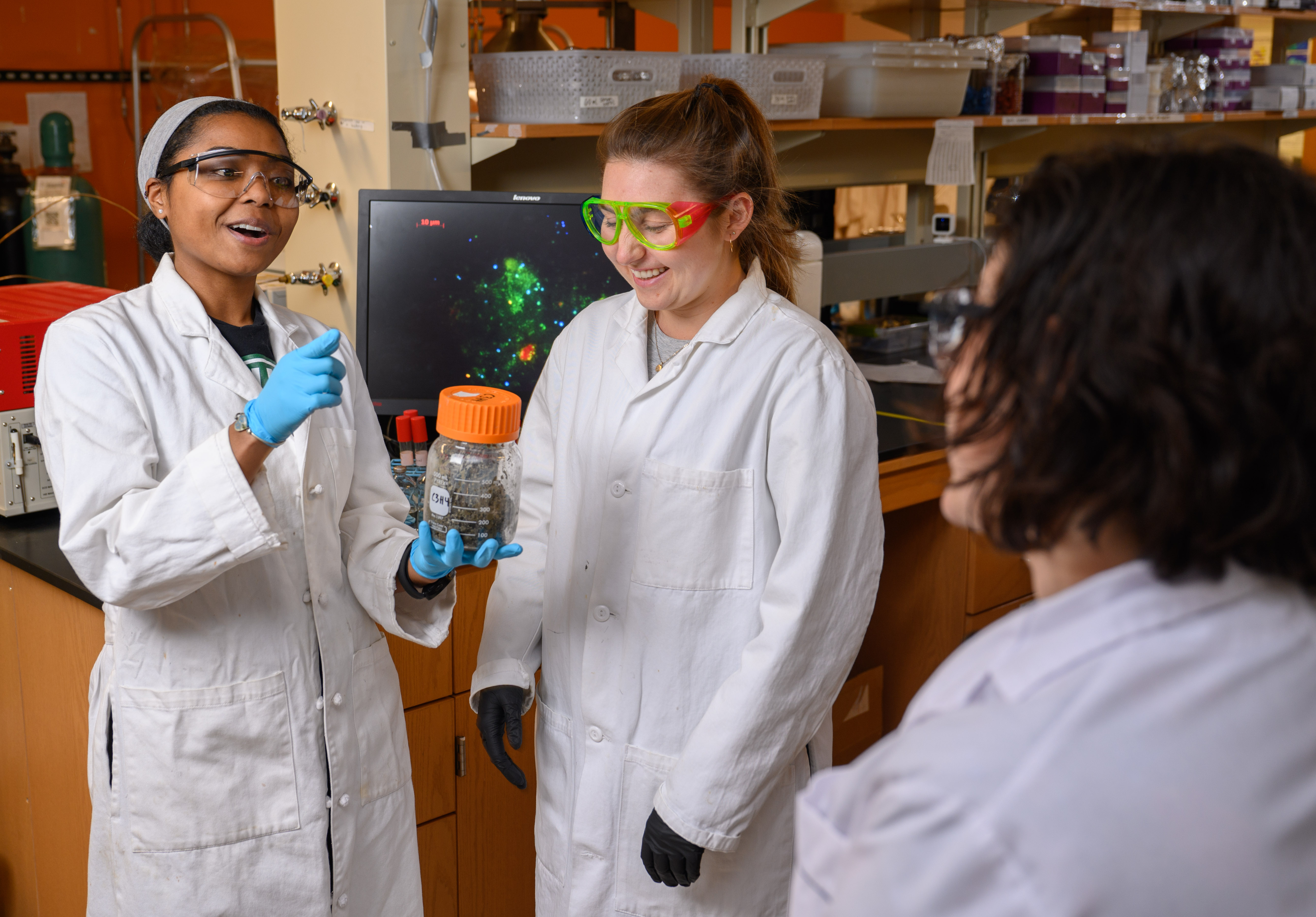 Student holds sediment