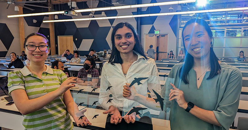 Bird Safe Campus team show their prototype window decals. L to R. - Amanda Janusz, Shivani Potdar, and Kaitlyn Tran.