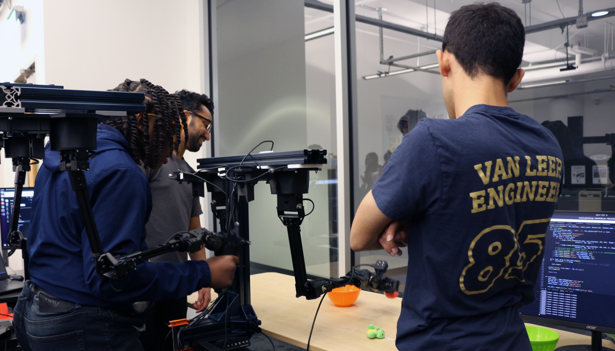 High School student using a dual hand imitation framework to train a robotic arm