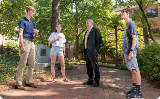 President Angel Cabrera speaking with students