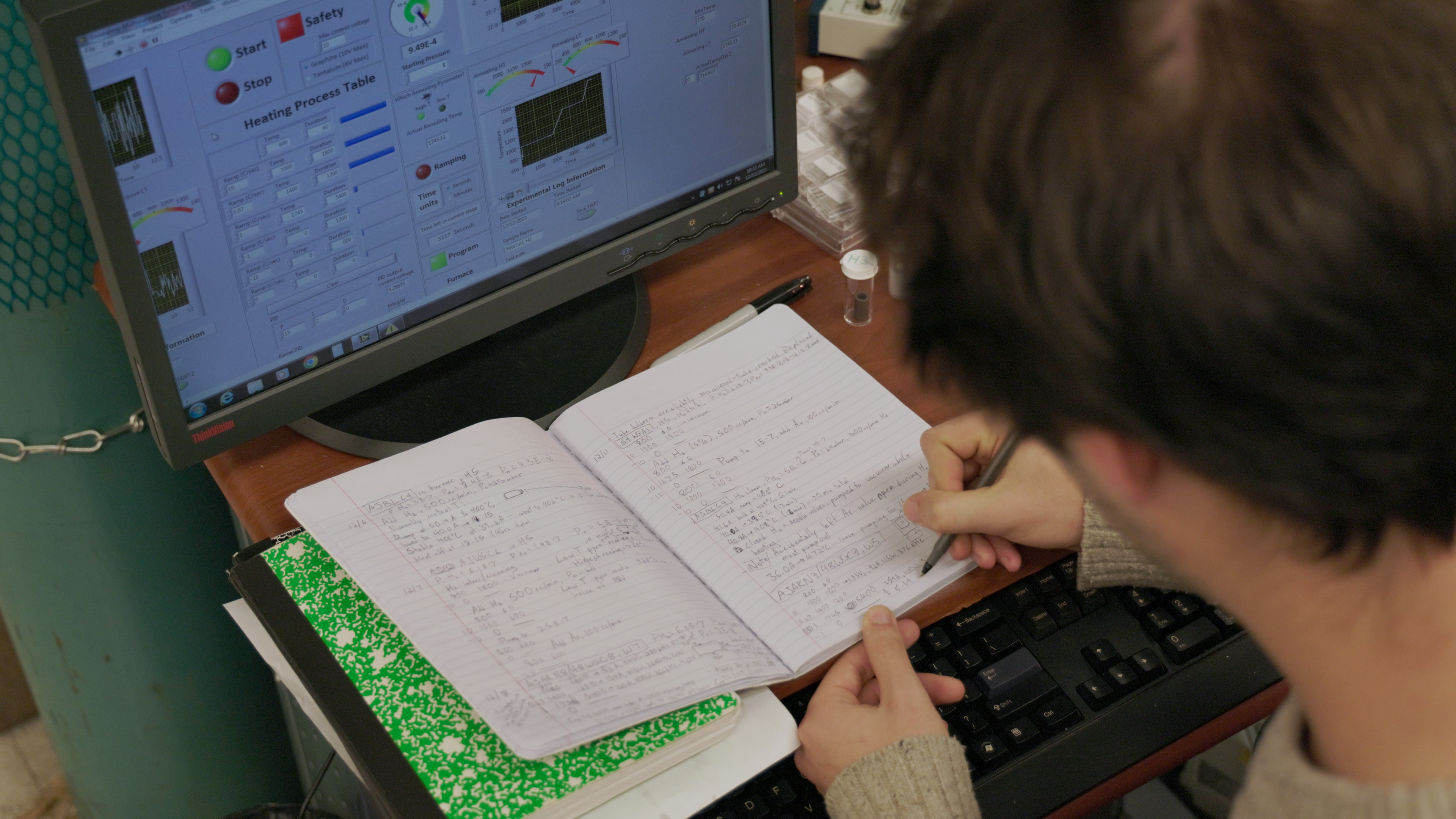 researcher working in notebook
