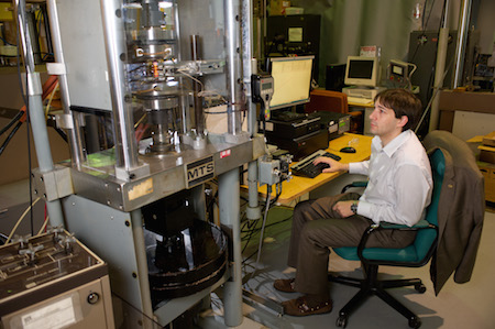 Researcher working on the Instron 5982 Universal Materials Testing System