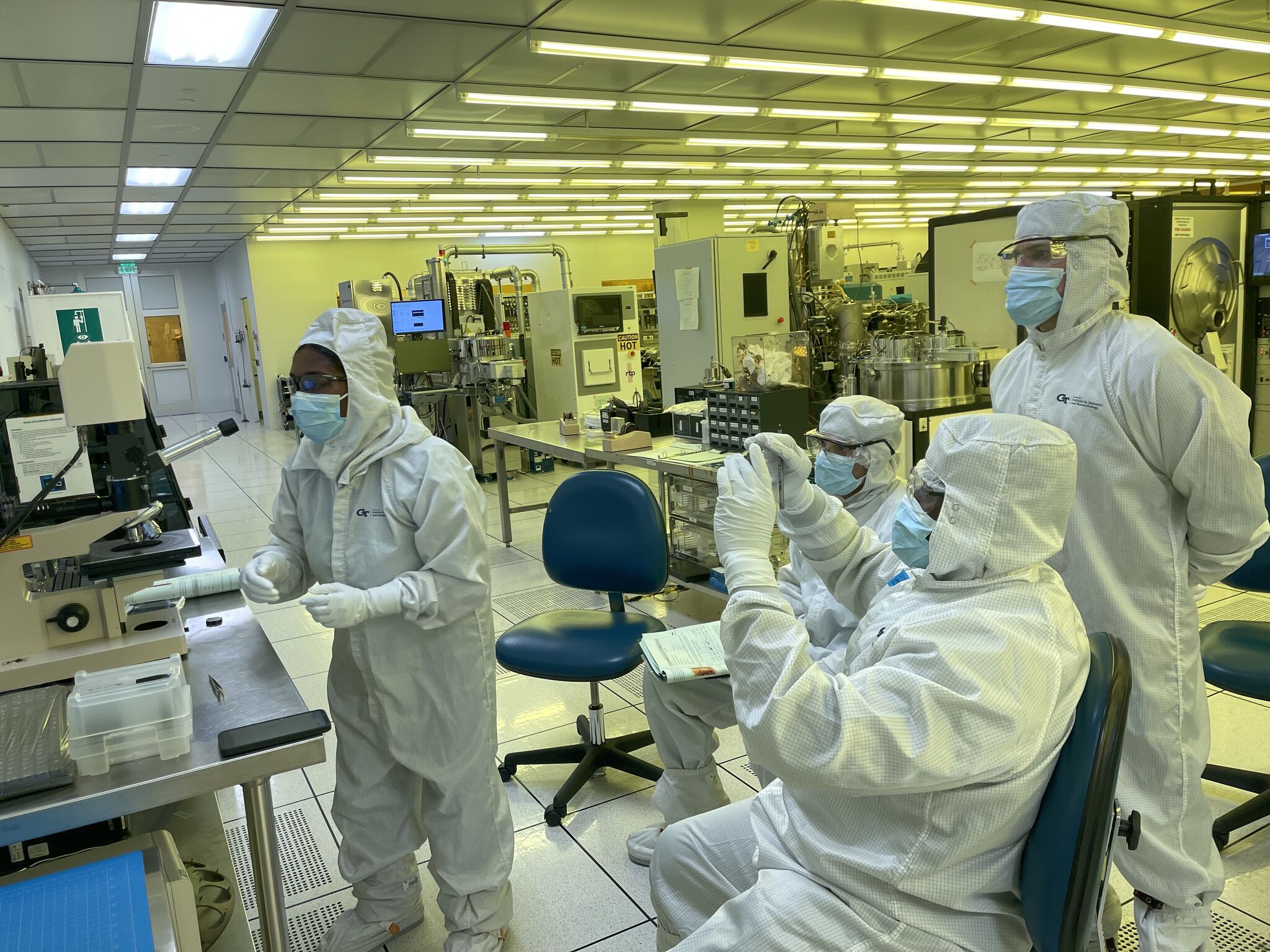 1744652605110.jpeg People in the cleanroom working on tools