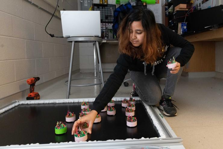 <p>Dana Randall, Daniel Goldman, and Bahnisikha Dutta work together on creating magnetic robots. This photo was taken in 2019 at Georgia Tech as part of a previous research study (Credit: Allison Carter, Georgia Tech)</p>