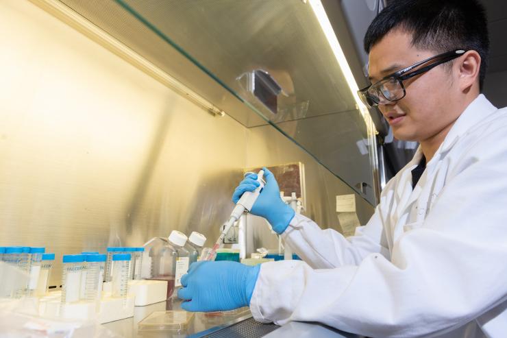<p>Jichuan Qiu, a postdoctoral fellow at Georgia Tech, researches how nanoscale materials could be used in medical treatments. (Credit: Allison Carter)</p>