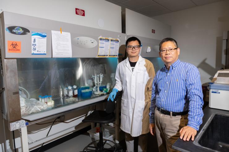 <p>Jichuan Qiu, a postdoctoral fellow at Georgia Tech and Younan Xia, professor and Brock Family Chair in the Wallace H. Coulter Department of Biomedical Engineering at Georgia Tech and Emory University. (Credit: Allison Carter)</p>