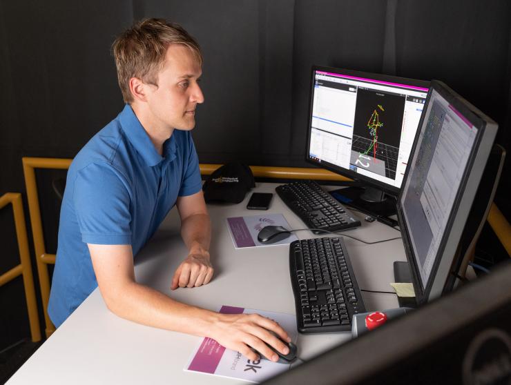 <p>Pawel Golyski uses a computer to operate the CAREN during experiments.</p>