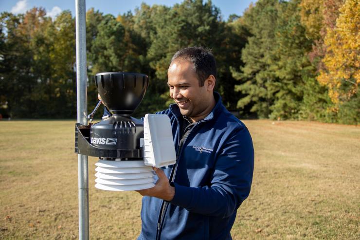 <p>Alessio Medda, a GTRI senior research engineer, checks out equipment used for recording infrasound signals. GTRI is using wavelet technology to analyze signals that can determine the location of the source and deliver information about what’s generating the noise. (Credit: Christopher Moore, GTRI).</p>