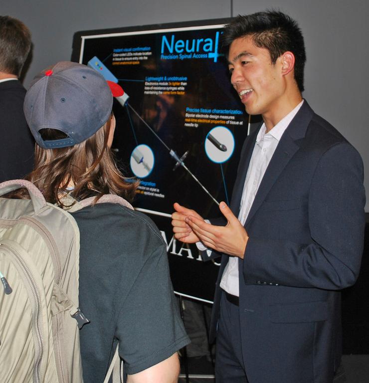 <p>Cassidy Wang explains Neuraline's work to interested guests at the Capstone Design Expo.</p>