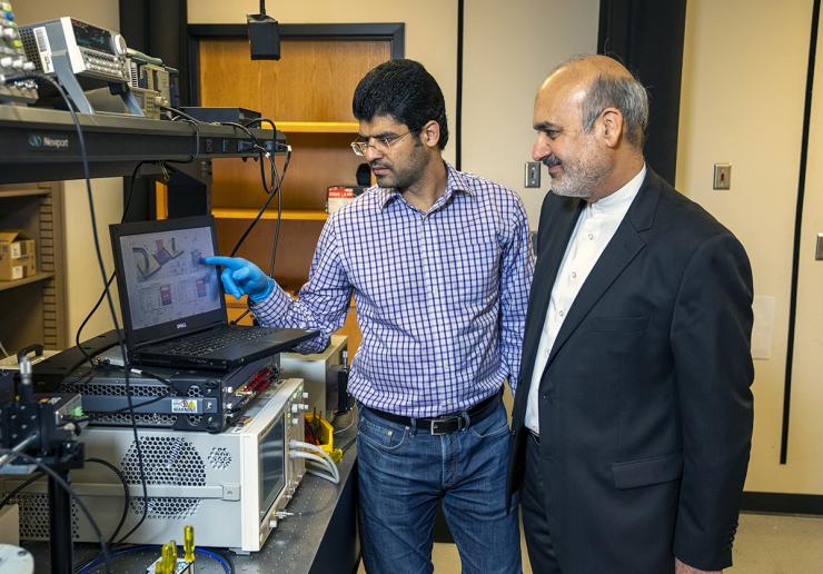 <p>ECE professor Ali Adibi with Ph.D. candidate Sajjad Abdollahramezani in Ali’s Photonics Research Group lab where the characterization of the tunable metasurfaces takes place.</p>