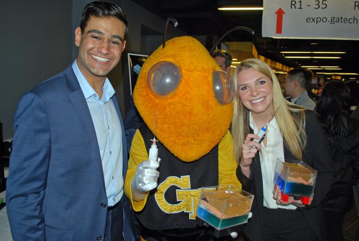 <p>Dev Mandavia and Marci Medford had a special visitor during the Capstone Design Expo.</p>