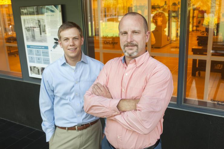 <p>Research engineer and student Brooks Tellekamp (left) and Alan Doolittle, professor of electrical and computer engineering, stand outside the clean room at Georgia Tech's Marcus Nanotechnology Building. Credit: Georgia Tech / Christopher Moore</p>