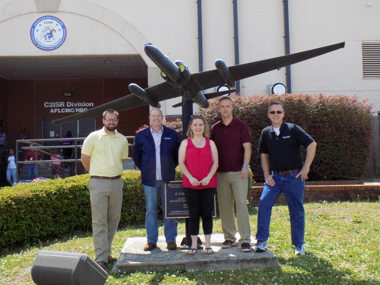 <p>Photo shows a portion of the Warner Robins-based GTRI team that is supporting the Air Force Distributed Common Ground System. Shown (left-to-right) are Derek Munday, Shawn Ashley, Amy Donovan, Clayton Besse and Mark Burnette. (Photo Credit: Georgia Tech Research Institute)</p>
