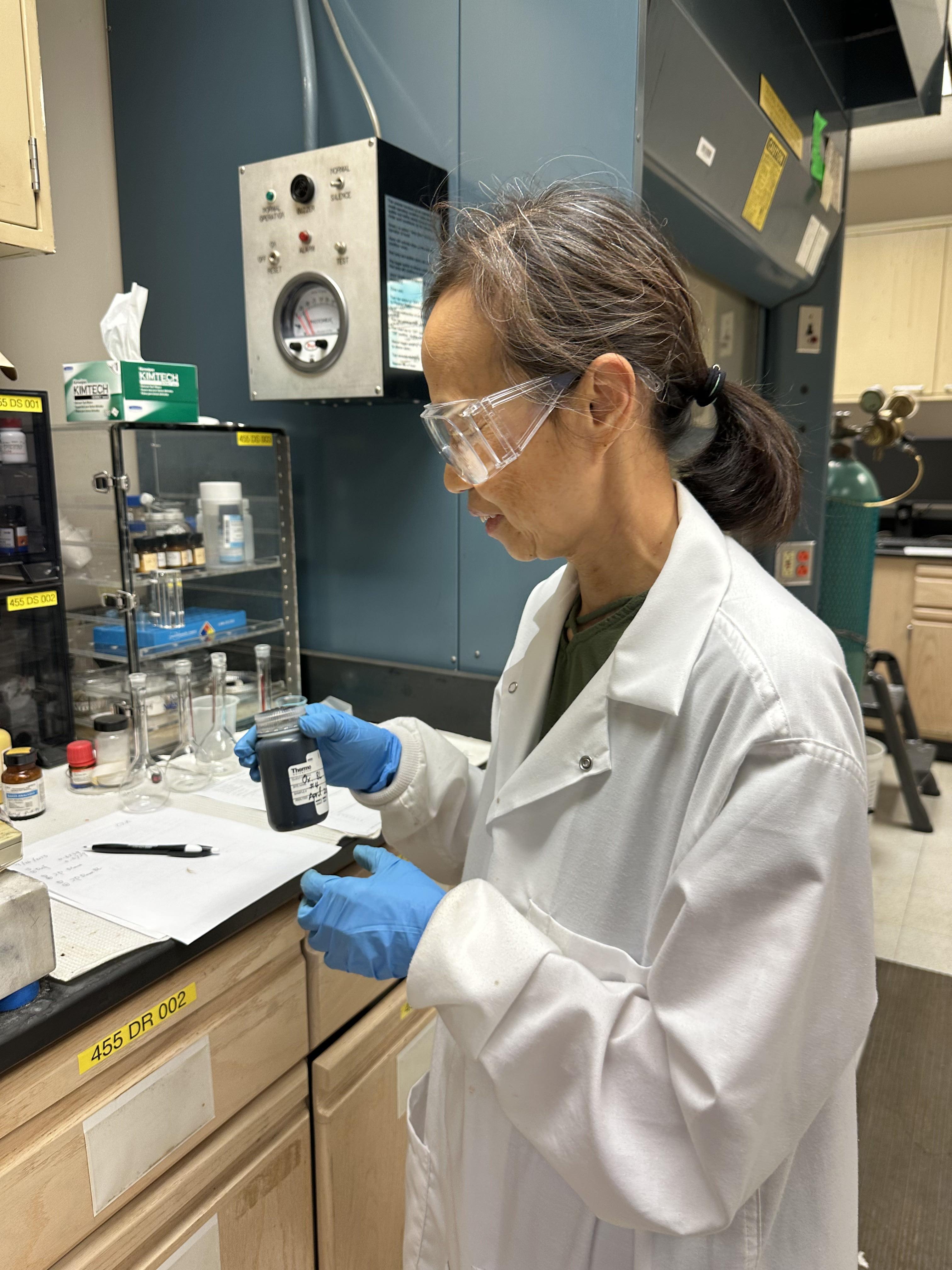Xiaoyan Zeng, an RBI Research Scientist preparing black liquor for identifying anions