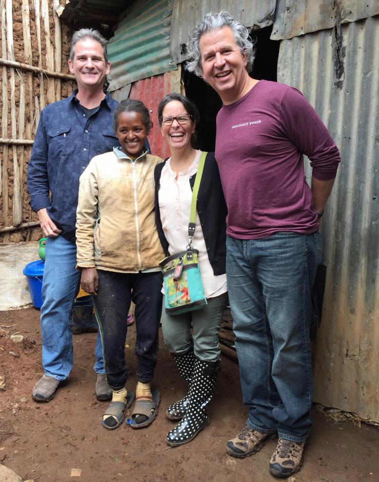<p>James Stubbs (left), and Katie and Rudy Gleason (at right) visit with one of their hosts (second from left) in Addis Ababa.</p>