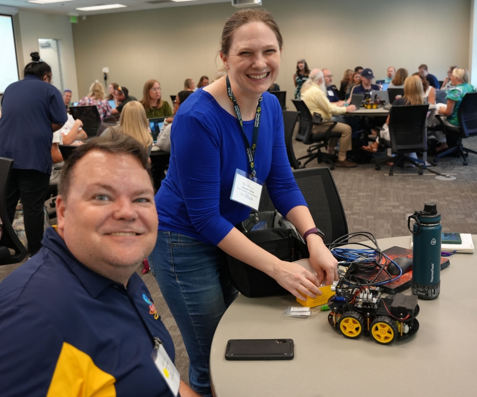 Rural CS teacher Jansen Haight with GTRI's Elizabeth Parrish at fall 2024 kickoff. 