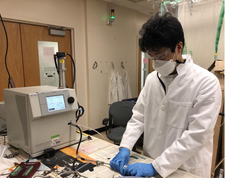 <p>Graduate student Taekyu Joo setting up the filtration efficiency measurement system. (Credit: Fobang Liu, Georgia Tech)</p>