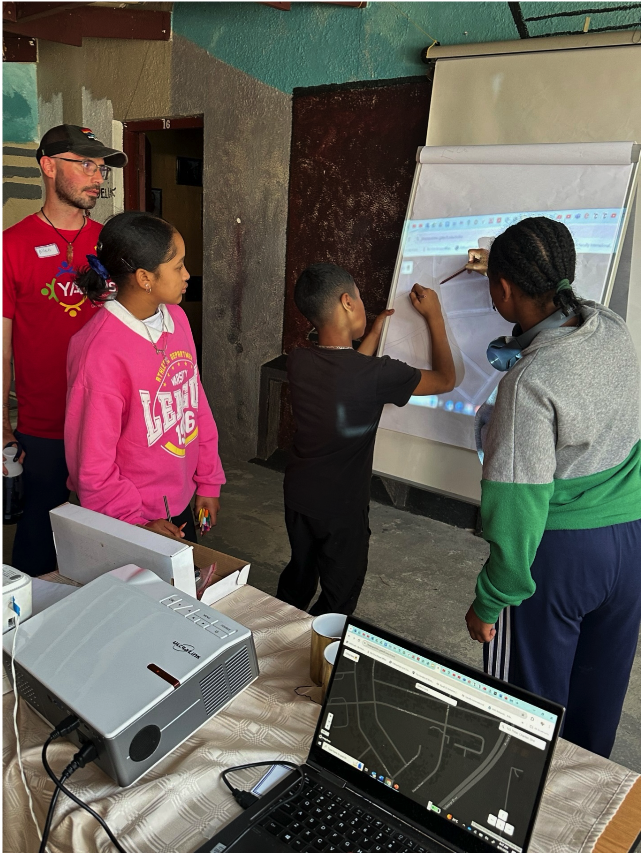 Cape Flats YMCA students working on projected maps with Allen Hyde.