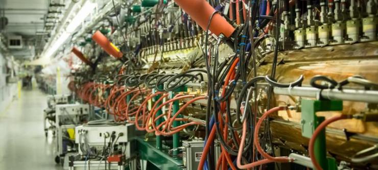 <p>An accelerator brings protons to near light speed before they trigger a neutron stream that is fired at the material being investigated at Oak Ridge National Laboratory's Spallation Neutron Source. Credit: Oak Ridge National Laboratory</p>
