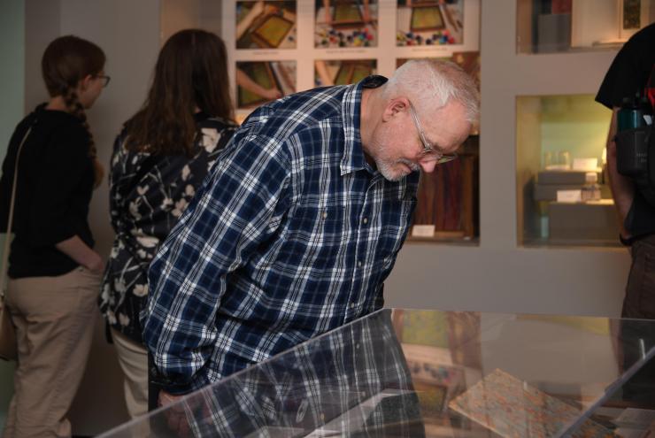 <p>Papermaking Museum: Robert Thompson views items on display at the exhibit 'Marvelous Marbling: Demystifying Marbled Papers'</p>