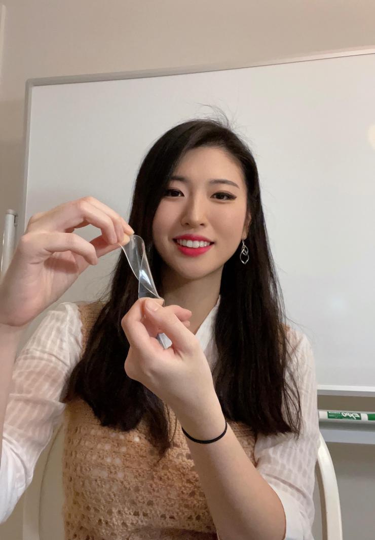 <p>Kyungjin Kim demonstrating a stretched elastomer film. While at Georgia Tech, Kim was co-advised by Olivier Pierron, professor in the George W. Woodruff School of Mechanical Engineering and by Samuel Graham, former chair of the Woodruff School of Mechanical Engineering.   (Photo credit: Kyungjin Kim )</p>