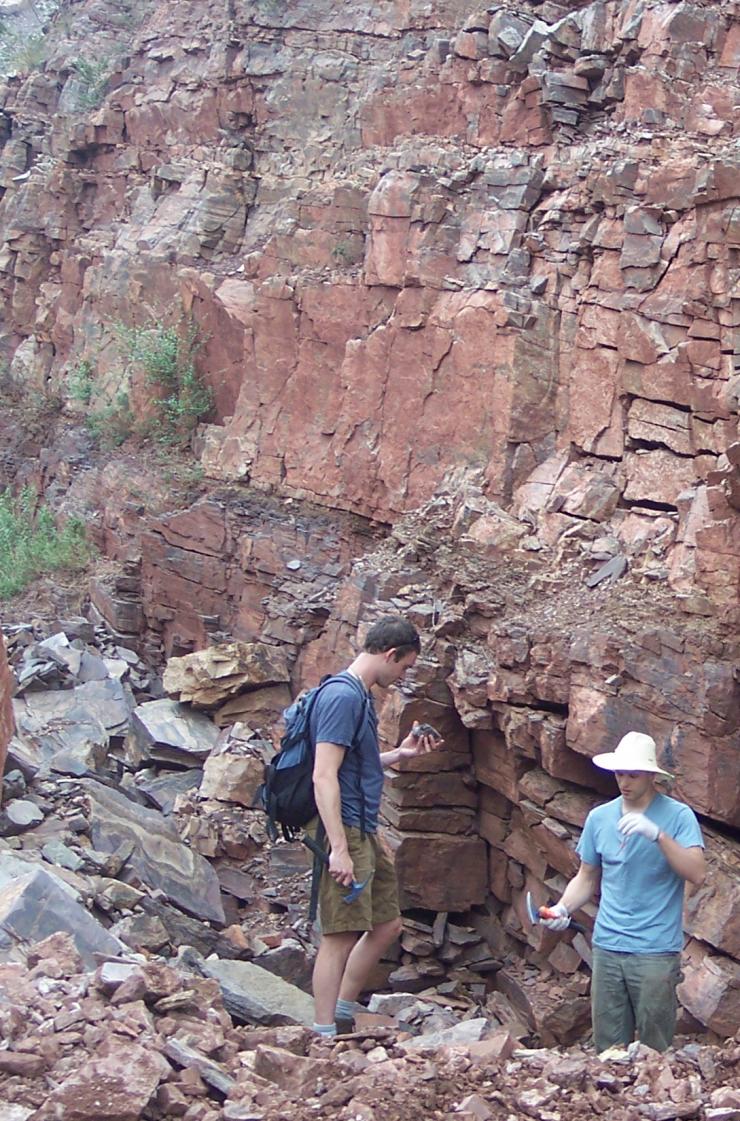<p>Reinhard (left) and Planavsky (right) sample marine sedimentary rocks deposited billions of years ago that provide a window into the Earth's evolution. Credit: Georgia Tech / Reinhard lab</p>