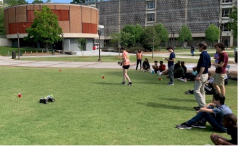 Campers compete by racing an RC car around Tech Green