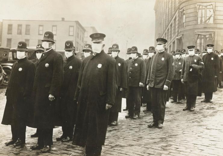 <p>Police officers in Seattle, Washington, don protective face masks during the Spanish flu pandemic. Credit: National Archives</p>