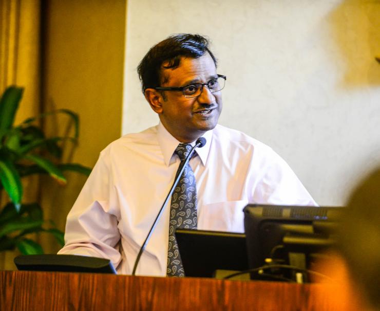 <p>Krish Roy, director of CMaT, introduces keynote lecturer Carl June.</p>