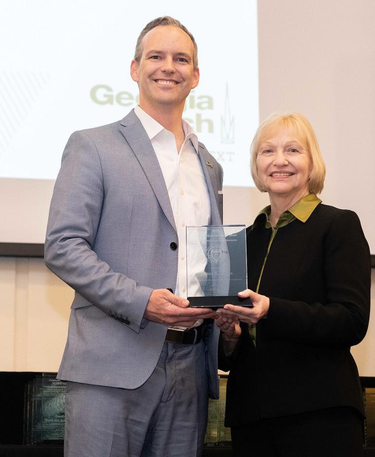 <p>James Rains accepts his award from Joyce Weinsheimer, director of the Center for Teaching and Learning (CTL) at Georgia Tech.</p>