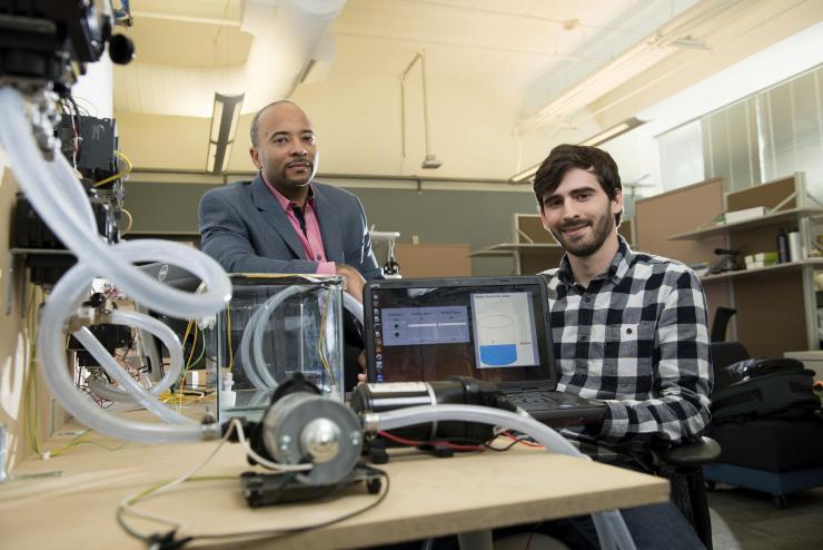 <p>Georgia Tech researchers have developed a new form of ransomware that can take over control of a simulated water treatment plant. The simulated attack was designed to highlight vulnerabilities in the control systems used to operate industrial facilities. Shown are (left) Raheem Beyah, associate chair in the Georgia Tech School of Electrical and Computer Engineering, and David Formby, a Georgia Tech Ph.D. student. (Credit: Christopher Moore, Georgia Tech) </p>