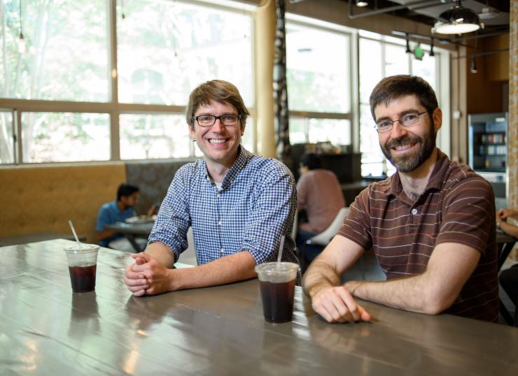 <p>Researchers Will Ratcliff (left) and Peter Yunker enjoy coffee at Highland Bakery.</p>