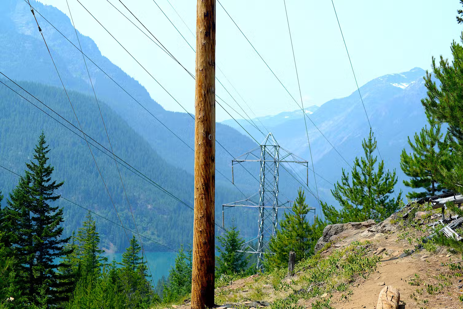 High-voltage power lines, like this one in North Cascades National Park in Washington state, often cross rugged terrain in areas in which it isn’t easy to bury a power line, or for firefighters to reach. Philippe Gerber/Moment via Getty Images