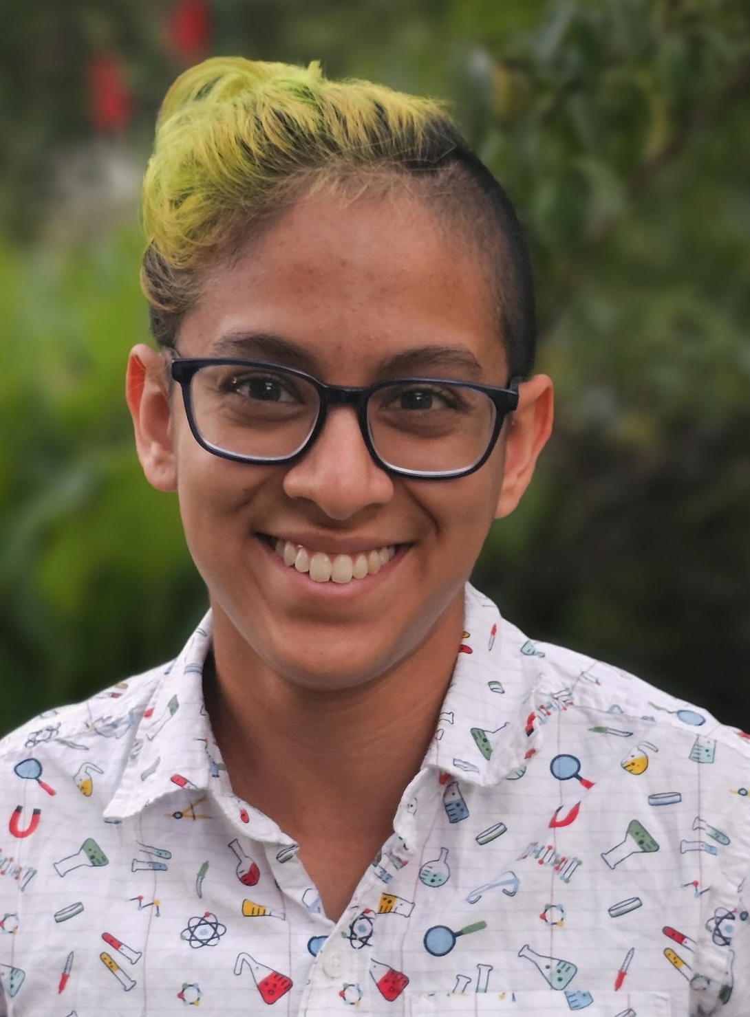 Advik Vira. He is wearing a colorful science-print button up.